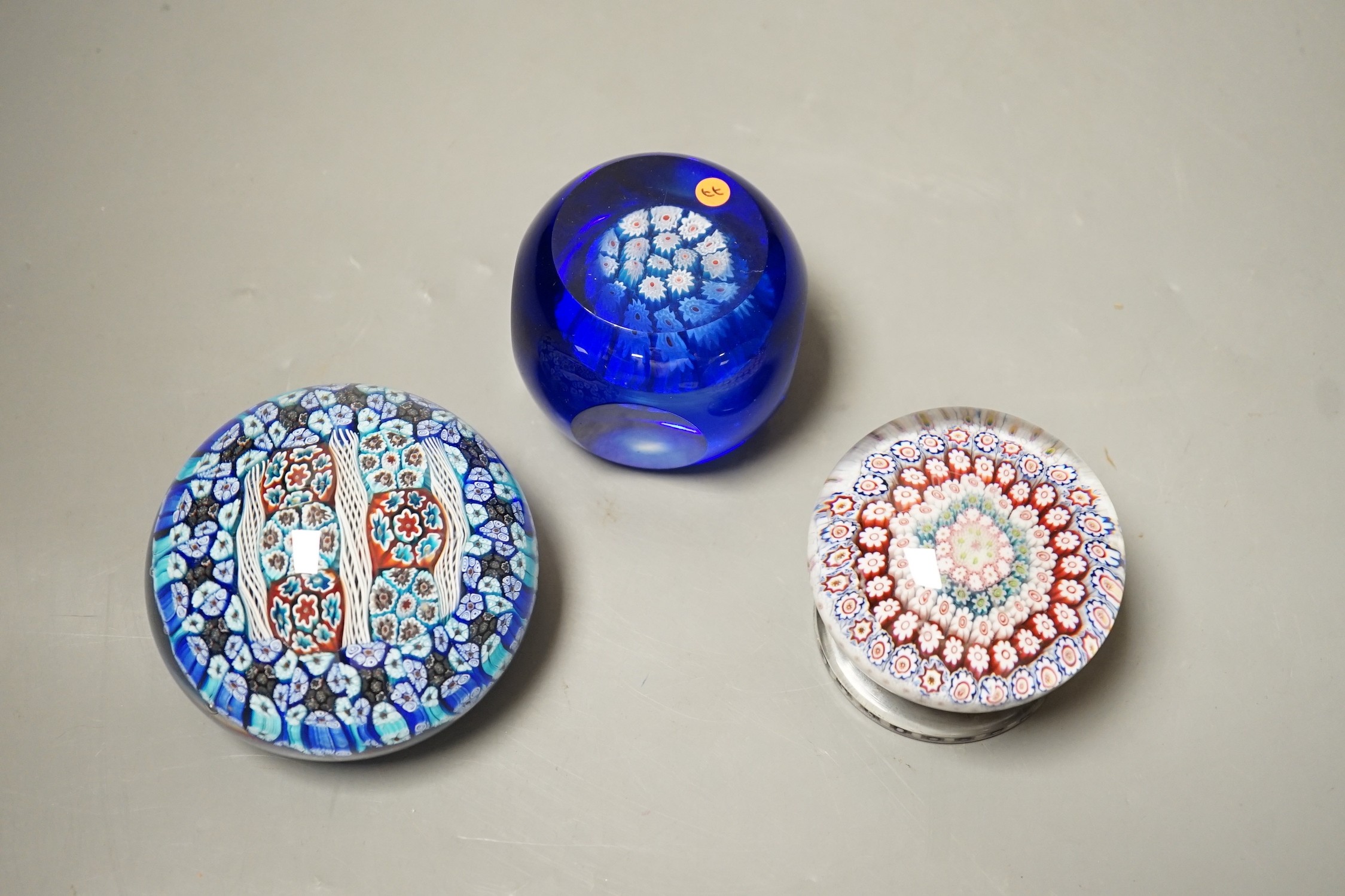 Three millefiori glass paperweights, largest 8cm diameter